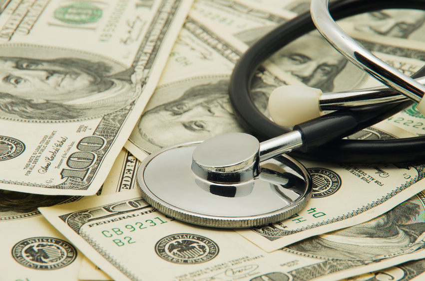 Image Depicts The Medical Expenses For Senior Citizens Concept - Showing A Stethoscope and US Dollars